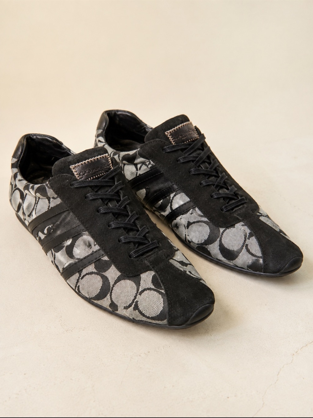 Coach Women’s Black and Cream Signature Logo Sneakers